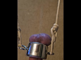 Holding 20 lbs with my balls, ordered by my Master.