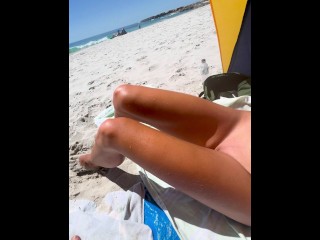 Teen couple on public beach and she touches his thin penis in front of strangers