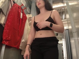 I try on clothes in fitting room with open curtain.