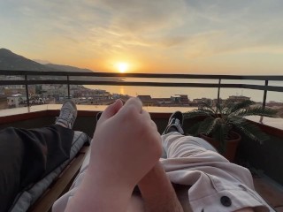 Horny handjob at sunset with a view over the bay
