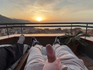 Horny handjob at sunset with a view over the bay