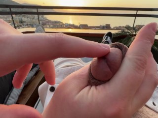 Horny handjob at sunset with a view over the bay