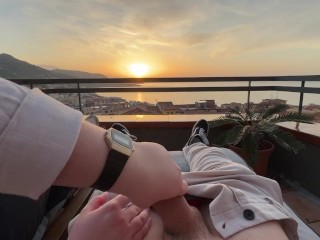 Horny handjob at sunset with a view over the bay