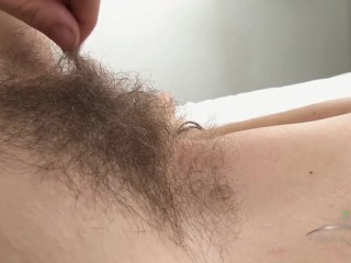 Selena is wiggling around in bed and waving her beautiful young bush at the camera