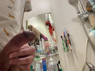 Morning pissing of uncircumcised penis in the bathroom