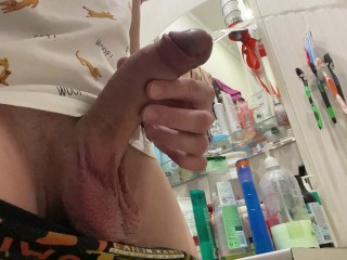 Morning pissing of uncircumcised penis in the bathroom