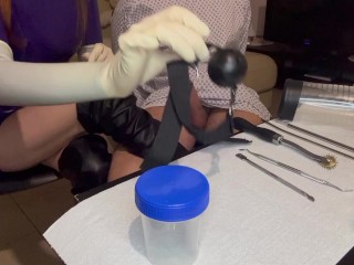 Misstress Nastya tries her new toys on his slave while wearing gynegological latex gloves