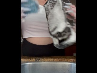 Housewife with no bra doing dishes