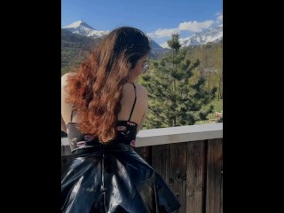 Young student shows off her charms against the backdrop of mountains