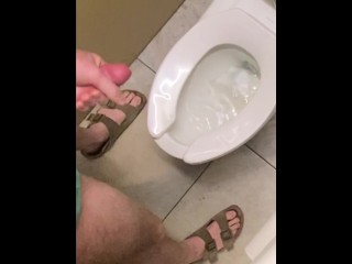 Hung guy freeballing at casino, big dick got hard so took off pants in bathroom and squirted a load.