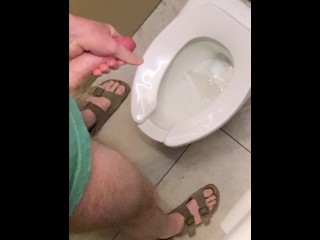 Hung guy freeballing at casino, big dick got hard so took off pants in bathroom and squirted a load.