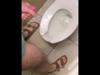Hung guy freeballing at casino, big dick got hard so took off pants in bathroom and squirted a load.