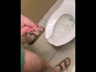 Hung guy freeballing at casino, big dick got hard so took off pants in bathroom and squirted a load.
