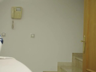 I'm ironing clothes in a blue T-shirt