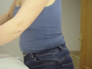 I'm ironing clothes in a blue T-shirt