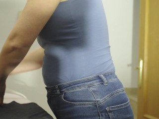 I'm ironing clothes in a blue T-shirt