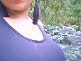 Ebony milf with red wig gets conscious next to a river