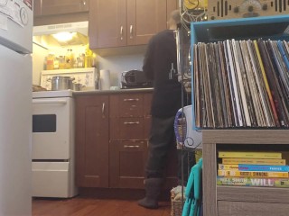 Bachelor undress while doing dishes.