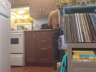 Bachelor undress while doing dishes.