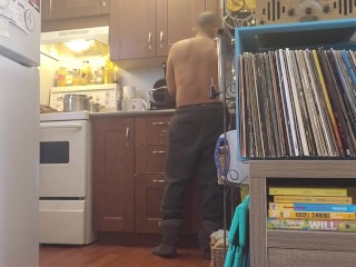 Bachelor undress while doing dishes.