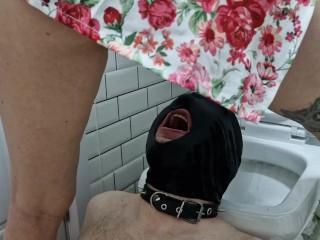Pissing. Toilet slave. Dominatrix pisses in the mouth and on the body of her slave.