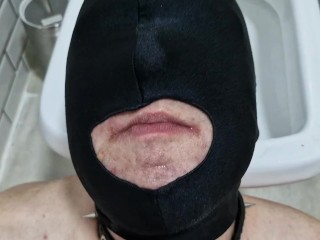 Pissing. Toilet slave. Dominatrix pisses in the mouth and on the body of her slave.