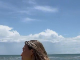 23 asian wife gives handjob on the beach in fishnet dress