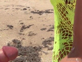 23 asian wife gives handjob on the beach in fishnet dress