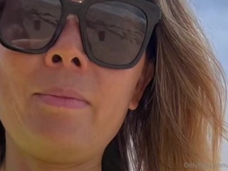 23 asian wife gives handjob on the beach in fishnet dress