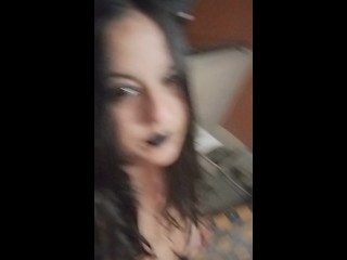 Smoking in a goth look provocative outfit