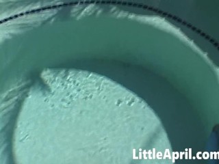 Little April fingers herself in the pool in a POV solo