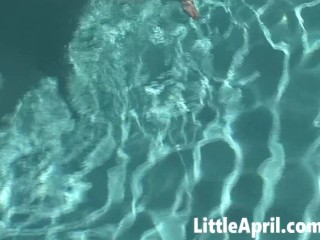 Little April fingers herself in the pool in a POV solo