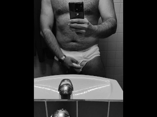 Hot guy in tighty whities pulls out his big soft cock in the office restroom