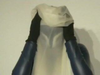 Girl In Blue White Latex Catsuit Mask Plays Breath Play With Rubber Sheet