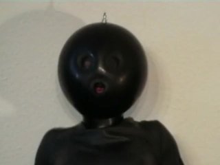 Latex Catsuit Girl With Black Rubber Ballhood Masturbates With Her Pussy