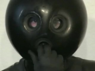 Latex Catsuit Girl With Black Rubber Ballhood Masturbates With Her Pussy