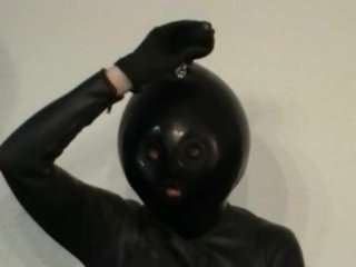 Latex Catsuit Girl With Black Rubber Ballhood Masturbates With Her Pussy