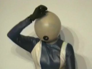 Girl With Transparent Latex Ballhood And Rubber Sheet Makes Breath Play