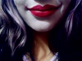 Harley Quinn playing with her mouth