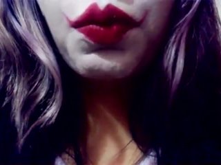 Harley Quinn playing with her mouth