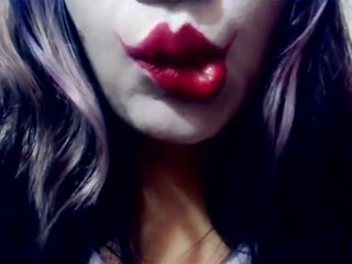 Harley Quinn playing with her mouth