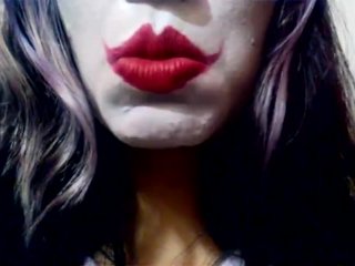 Harley Quinn playing with her mouth