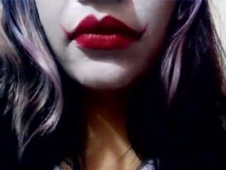 Harley Quinn playing with her mouth