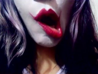 Harley Quinn playing with her mouth