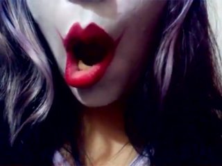 Harley Quinn playing with her mouth