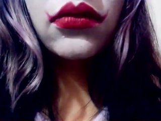 Harley Quinn playing with her mouth