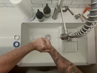 In-Home Massage Therapist Austin Wolf Washes Hands 