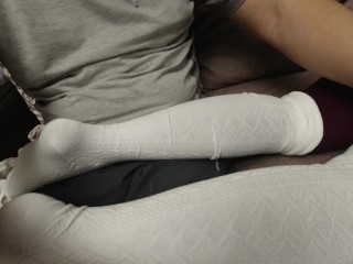 Sexy girl shows her feet in pantyhose and golf knee socks soles foot fetish