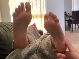 Tickling girlfriends tiny feet on the couch