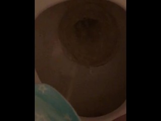 Petite Sabrina pulls her thong to the side and pees in the toilet